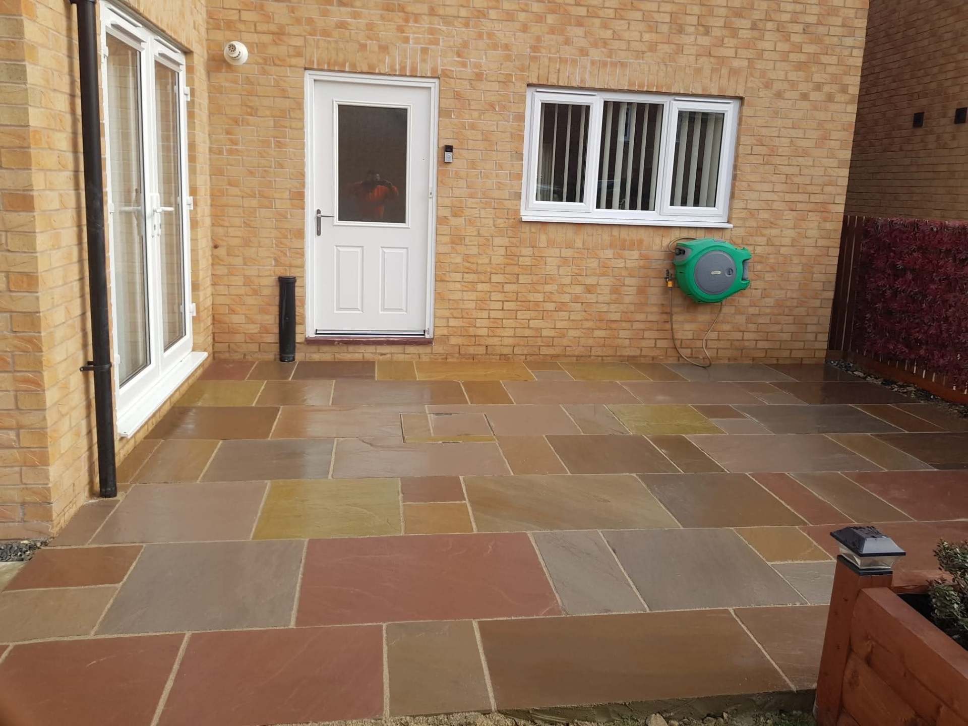 Buff block paving patio with charcoal border completed by E.R.D Paving